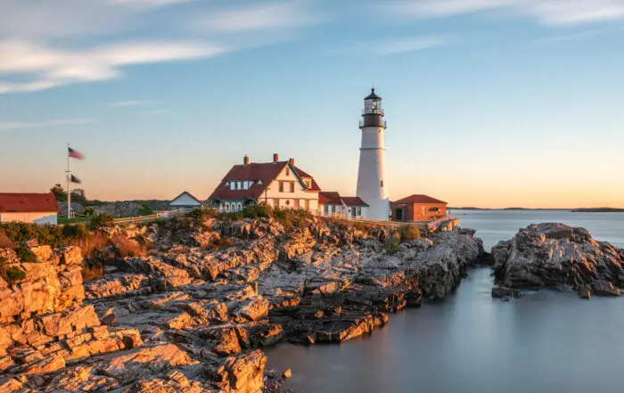 a white lighthouse on the Maine coast
