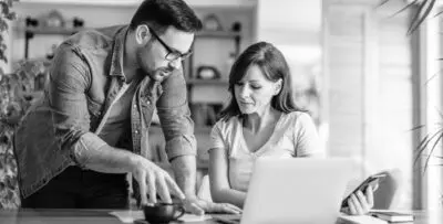 Man and women working on case management at a laptop computer